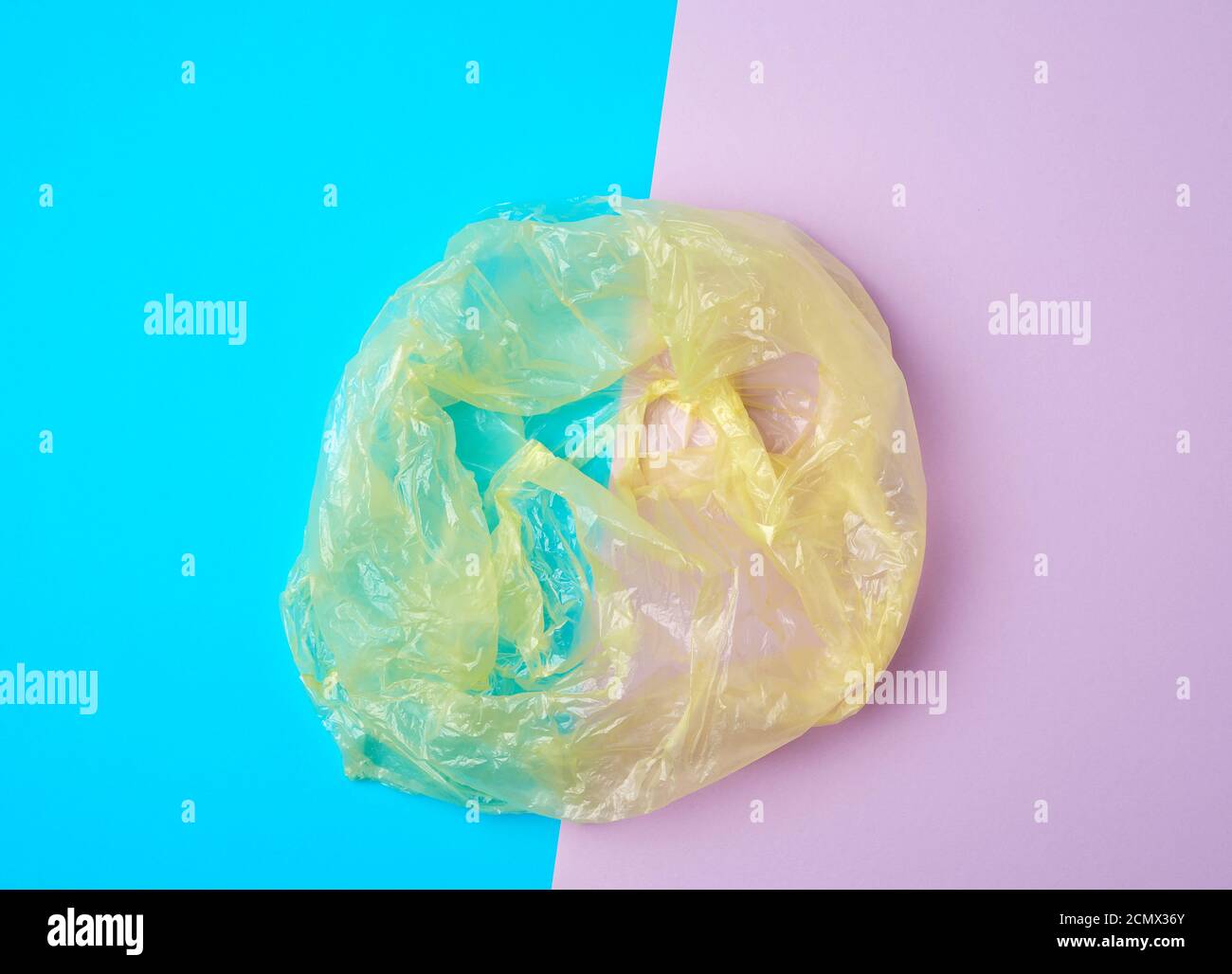 open empty plastic bag for products on a colored background Stock Photo