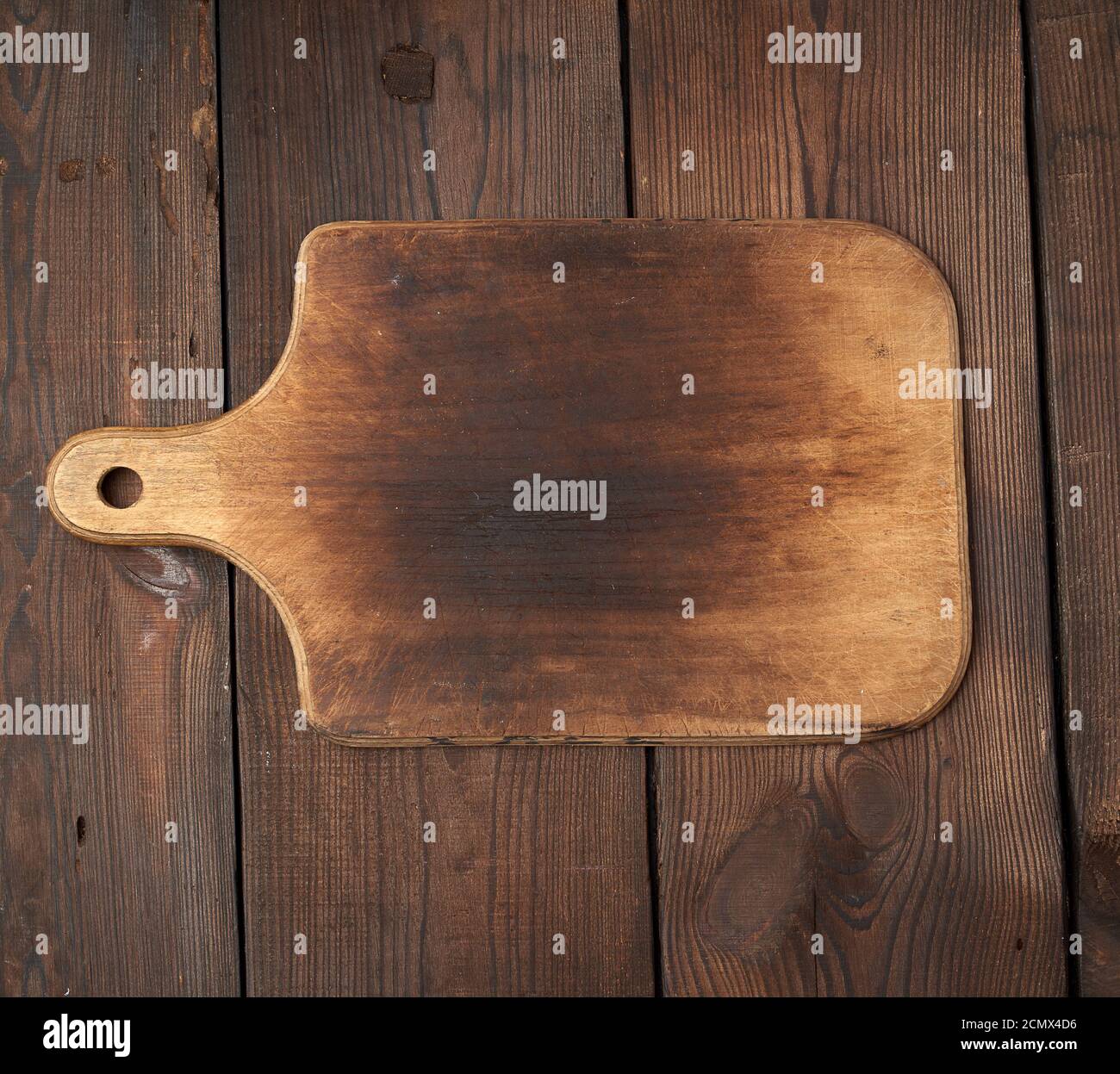 very old empty wooden rectangular cutting board Stock Photo