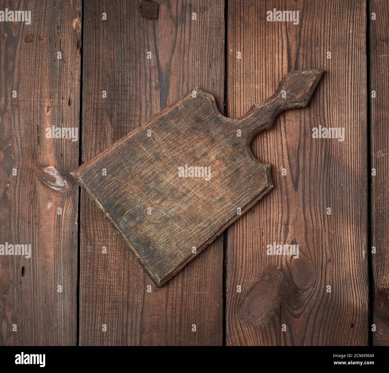 very old empty wooden rectangular cutting board Stock Photo