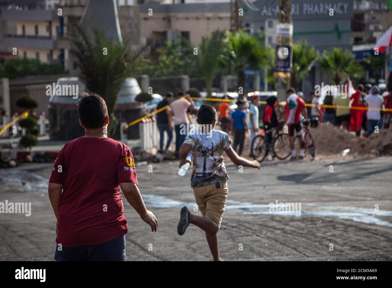 Nabatieh, South / Lebanon: Lebanese Protesters Revolution against the Government  | Boys running Stock Photo