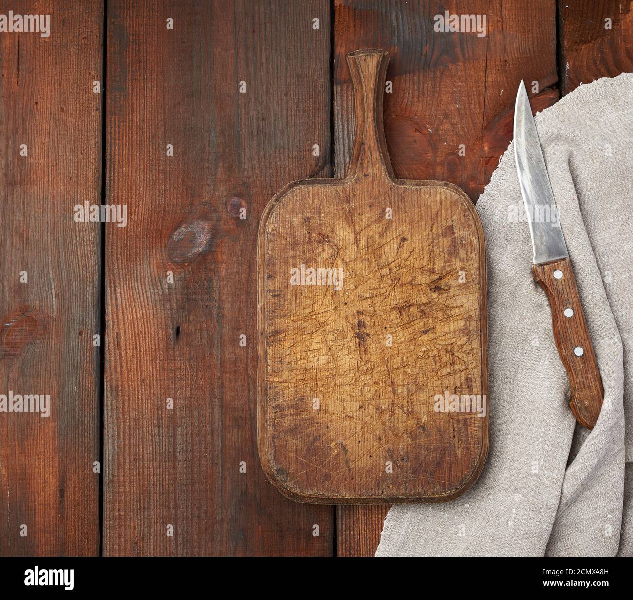 very old empty wooden rectangular cutting board and knife, top view ...