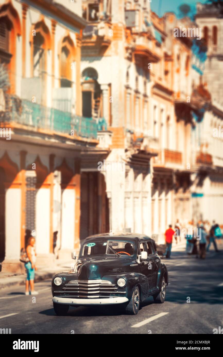 Colorful old buildings and a classic american car in Old Havana Stock ...