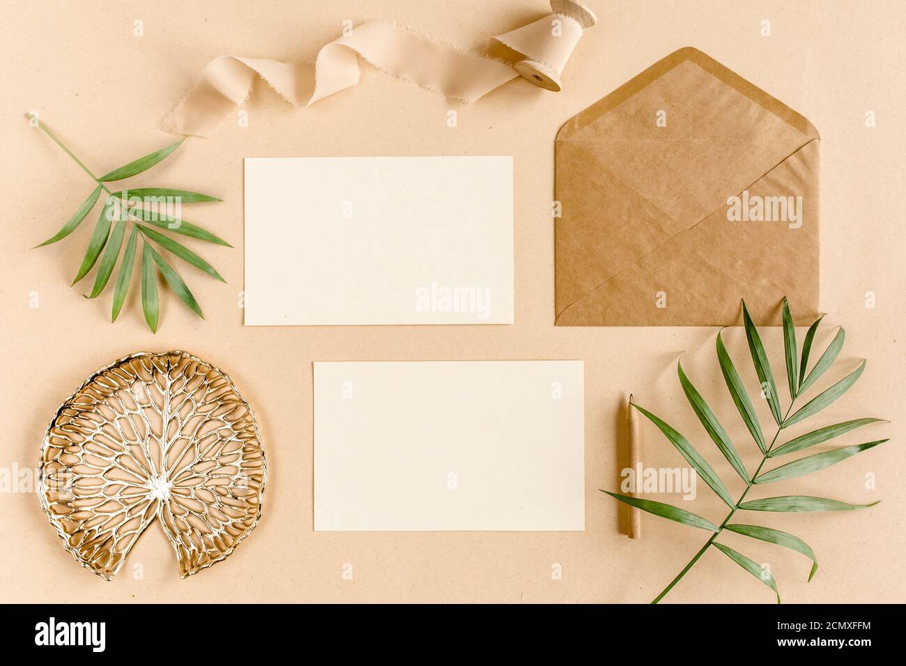 Stationary postcard mockup Invitation flatlay scene with tropical leaf JPG mock up