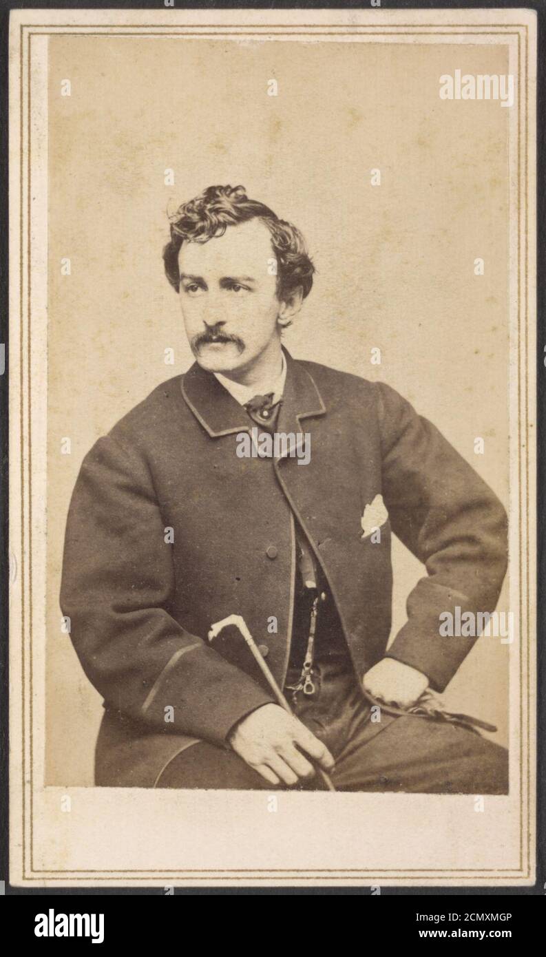 John Wilkes Booth seated, with cane in hand) - Silsbee, Case & Co., photographic artists, 299-1-2 Washington Street, Boston. Case & Getchell, from Dec. 3, 1862 Stock Photo