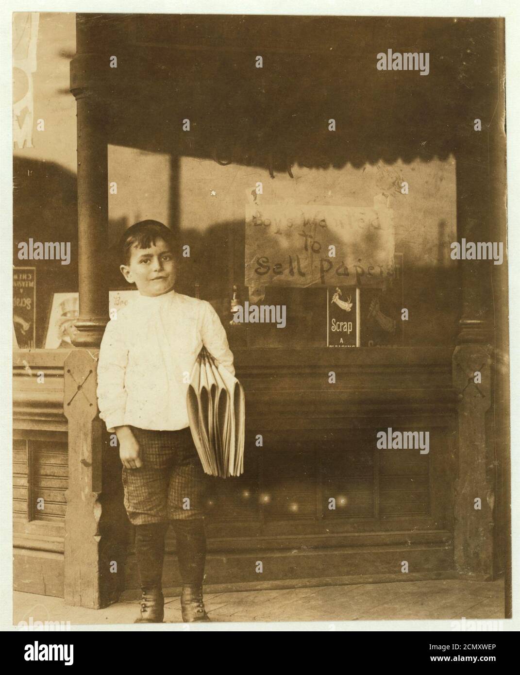 Johnnie Merkle 6 years old newsie. Home of Johnnie, 5110 N. Broadway. He is a regular newsie 6 years old. Father owns this house and butchers shop. Johnnie's brother owns and runs a Stock Photo