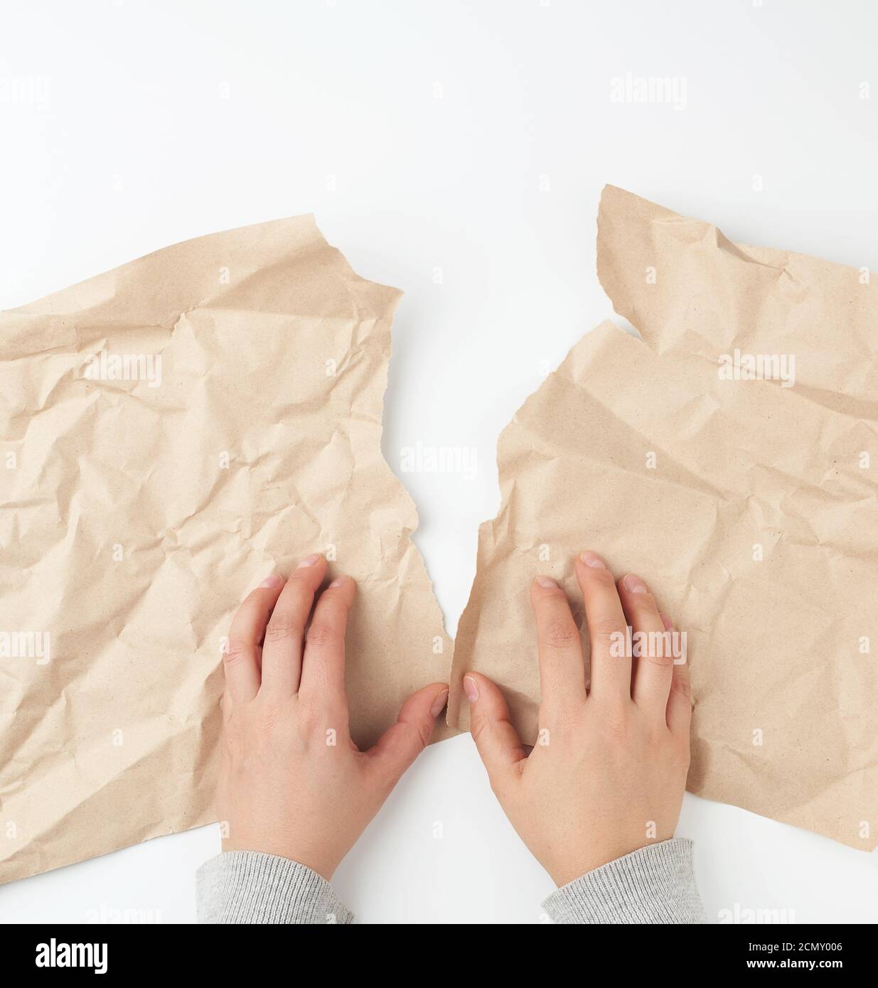 Hands tearing surface hires stock photography and images Alamy