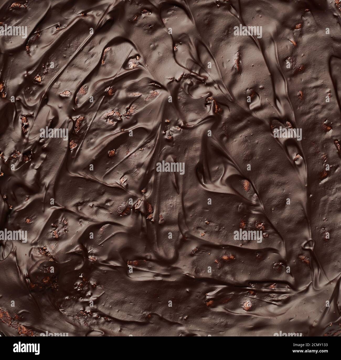 texture of baked brownie chocolate cake with chocolate poured Stock Photo
