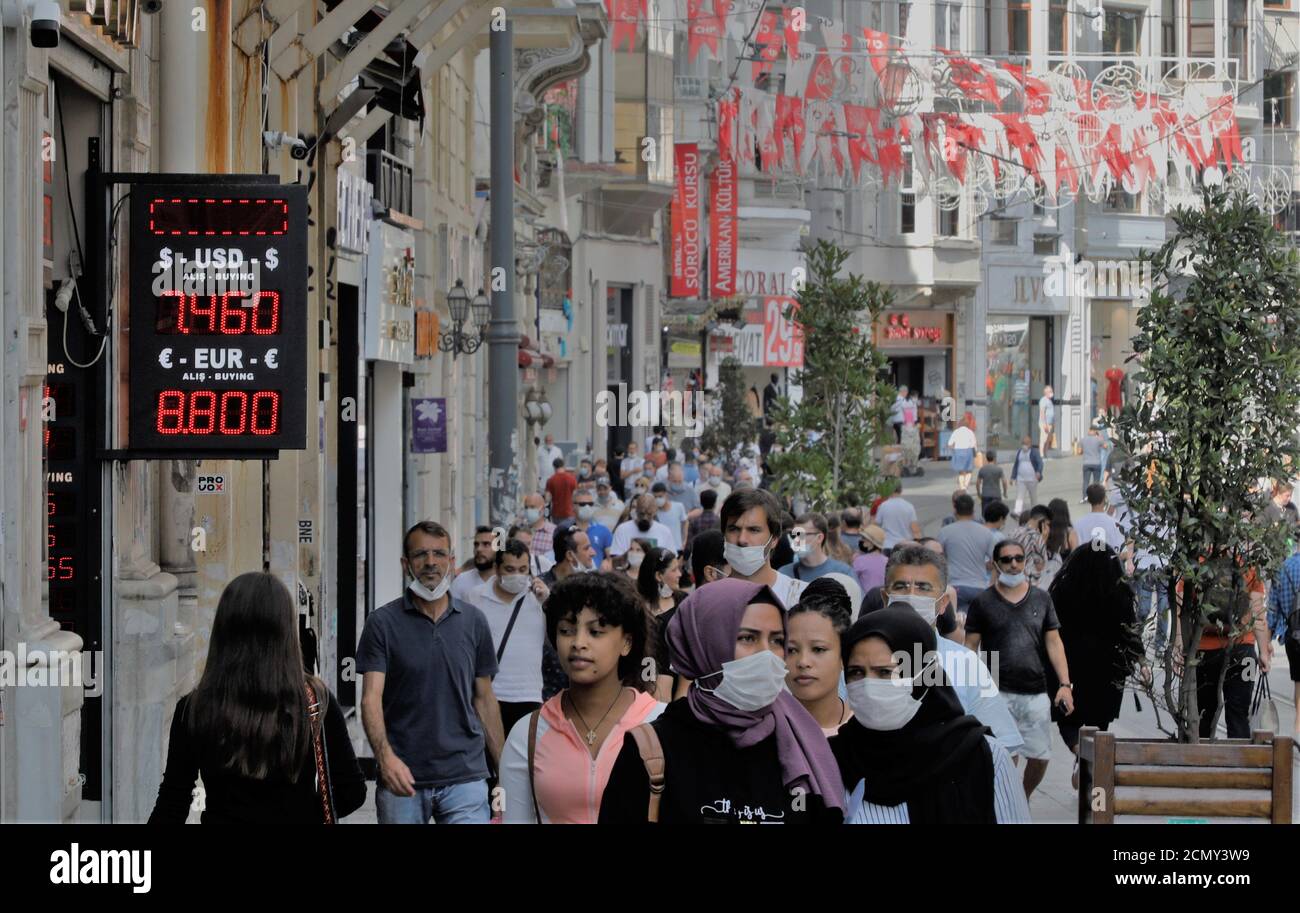 istanbul-turkey-17th-sep-2020-people-walk-past-a-board-showing-the