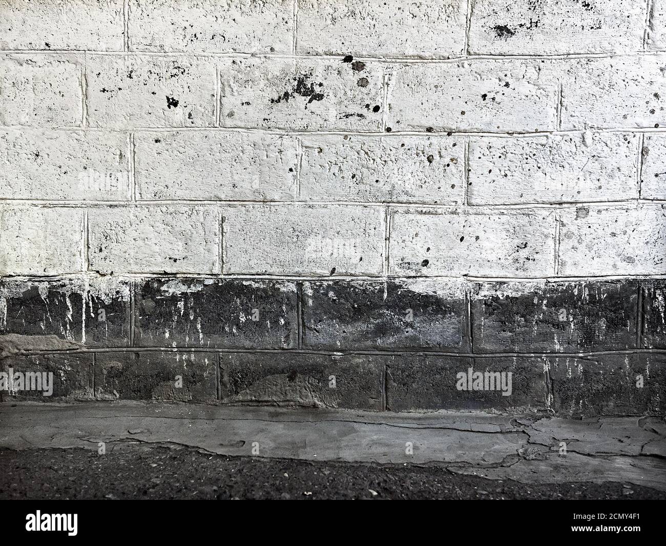 Old brick wall painted with white paint Stock Photo