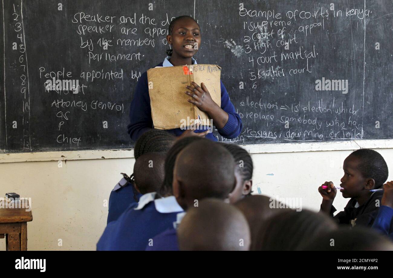 Sarah Nasira, 12, leads her classmates as they revise their class work without a teacher on the second week of a national teachers' strike, at Olympic Primary School in Kenya's capital Nairobi, September 9, 2015. The Kenya National Union of Teachers (KNUT) wants the Teachers Service Commission (TSC) to honour the 50-60 percent salary increment ordered by the Supreme Court in August, local media reported. REUTERS/Thomas Mukoya      TPX IMAGES OF THE DAY Stock Photo
