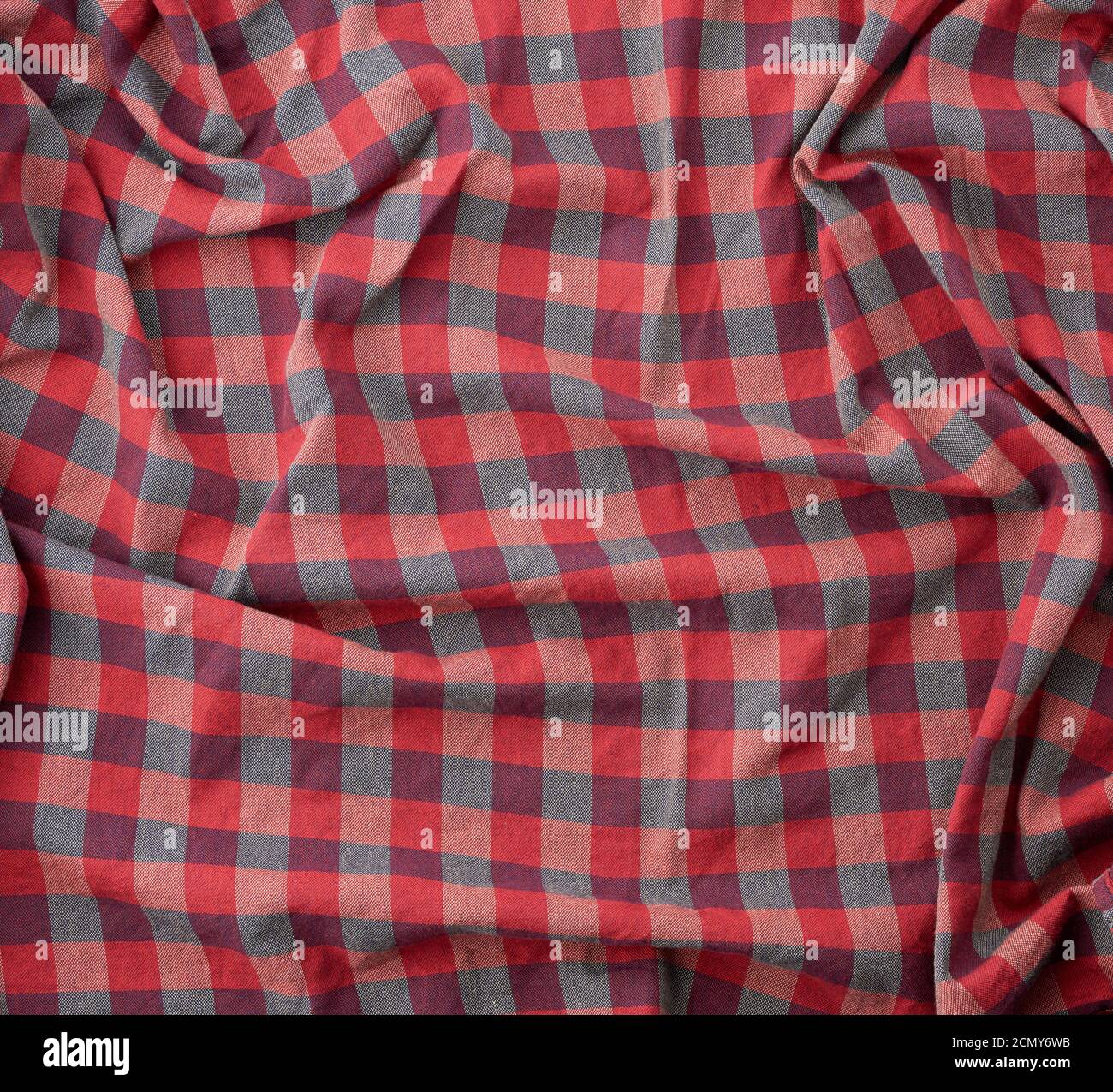red checkered fabric for sewing various clothes with waves Stock Photo