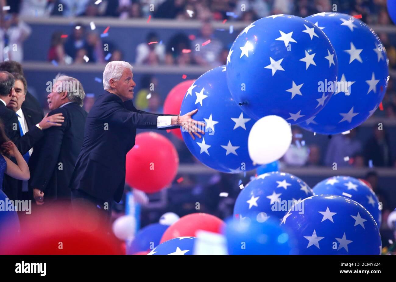 Former president Bill Clinton enjoys the balloon drop after his wife Democratic presidential nominee Hillary Clinton accepted the nomination on the fourth and final night at the Democratic National Convention in Philadelphia, Pennsylvania, U.S. July 28, 2016. REUTERS/Lucy Nicholson Stock Photo