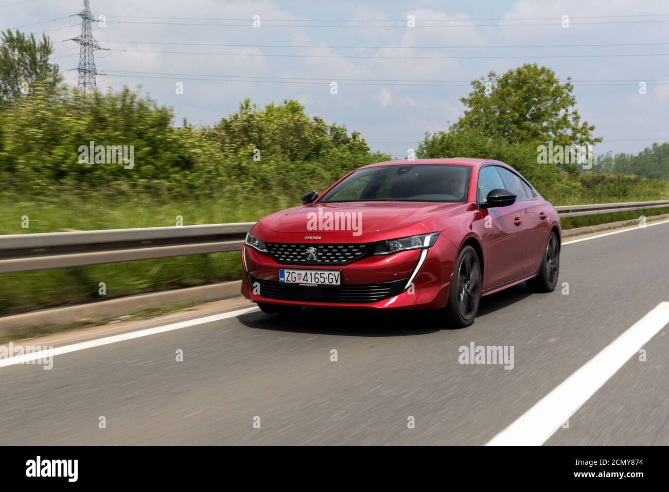 Brand New Peugeot 508 GT in beautiful red colour. Luxury business class limousine. Stock Photo