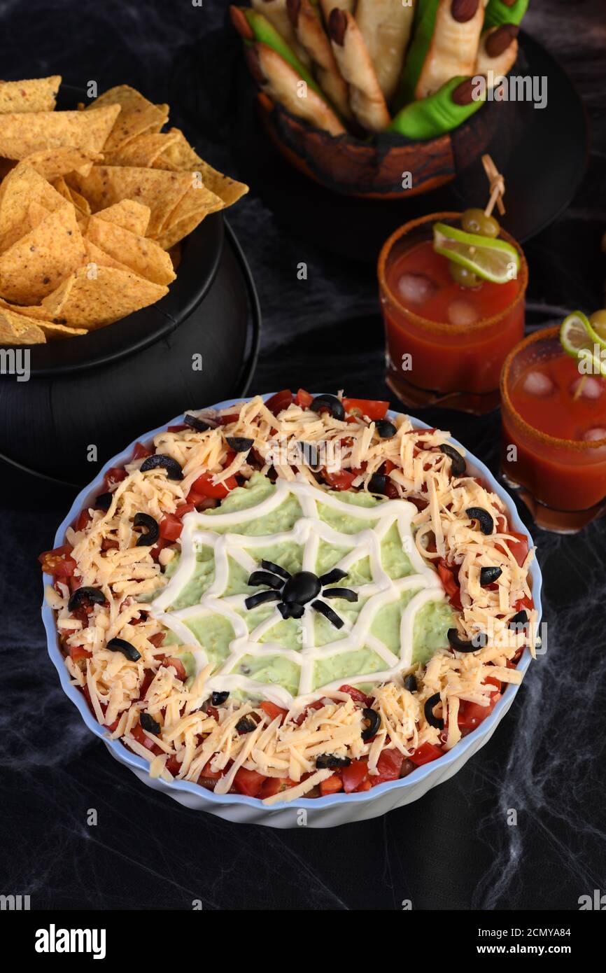 Spooky Halloween Seven Layer Taco Dip Turn a classic appetizer into a