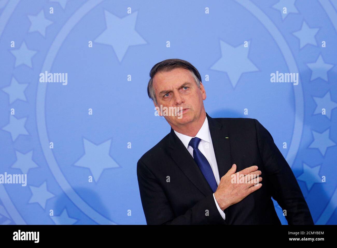 Brazil's President Jair Bolsonaro attends a ceremony for signature of the decree of the new regulation on the use, sale and carrying of weapons and ammunition, at Planalto Palace in Brasilia, Brazil May 7, 2019. REUTERS/Adriano Machado Stock Photo
