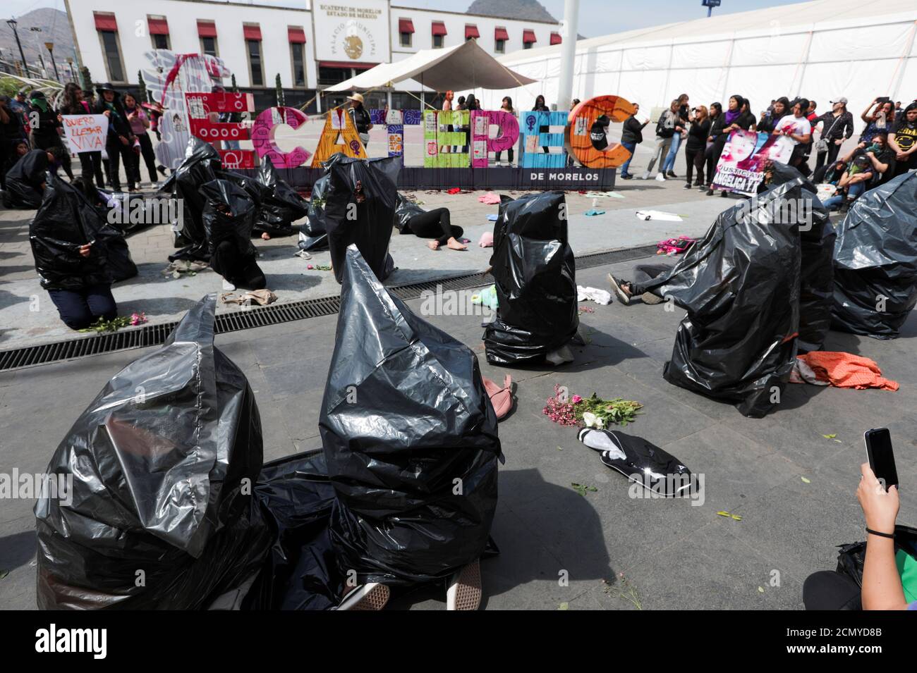 Women stage a performance to mark International Women's Day and to demand justice for the victims of gender violence and femicides, in Ecatepec, on the outsides of Mexico City, Mexico March 8, 2020. REUTERS/Luisa Gonzalez Stock Photo