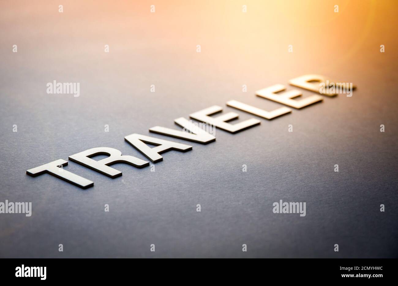 Word traveler written with white solid letters Stock Photo Alamy
