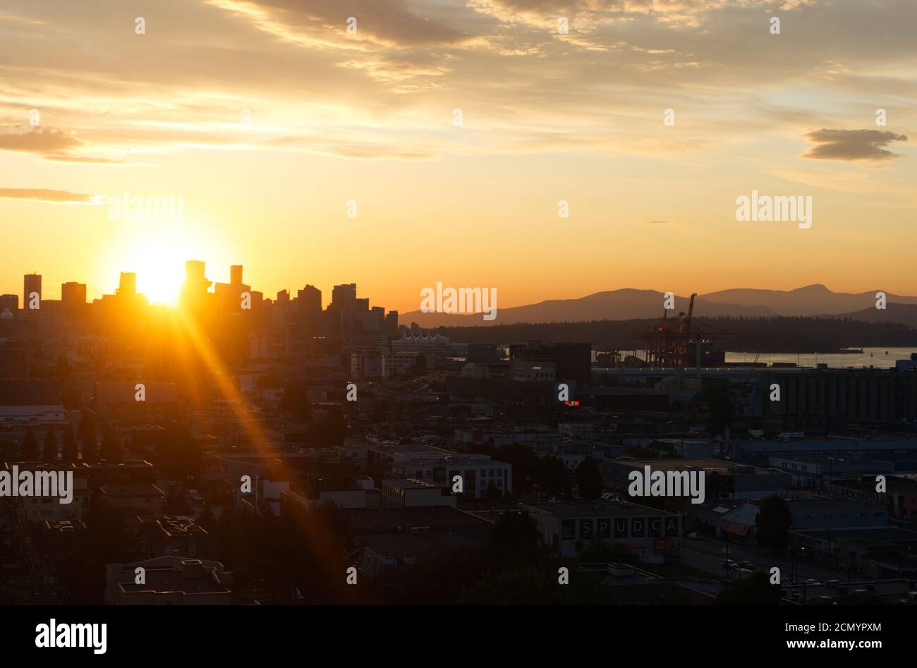 Walk on a Sun Beam, Sun beam Vancouver City, Vancouver BC Canada, Sunset between buildings Stock Photo