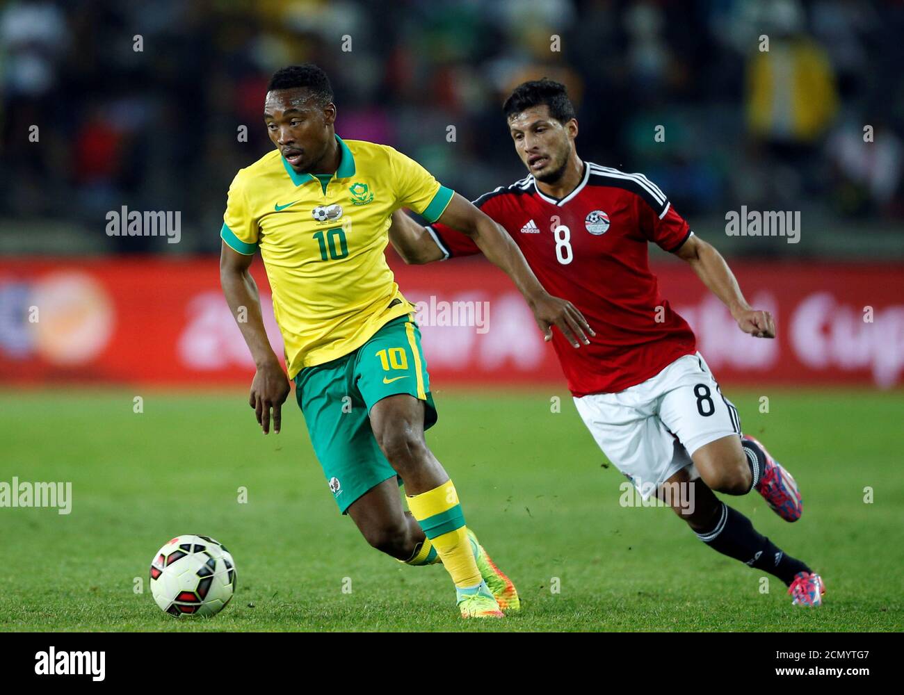 Football Soccer - South Africa v Egypt - Nelson Mandela Challenge soccer match - Orlando Stadium, Soweto, South Africa - 6/9/16 South Africa's Sibusiso Vilakazi (L) is challenged by Egypt's Tarek Hamed. REUTERS/Siphiwe Sibeko Stock Photo