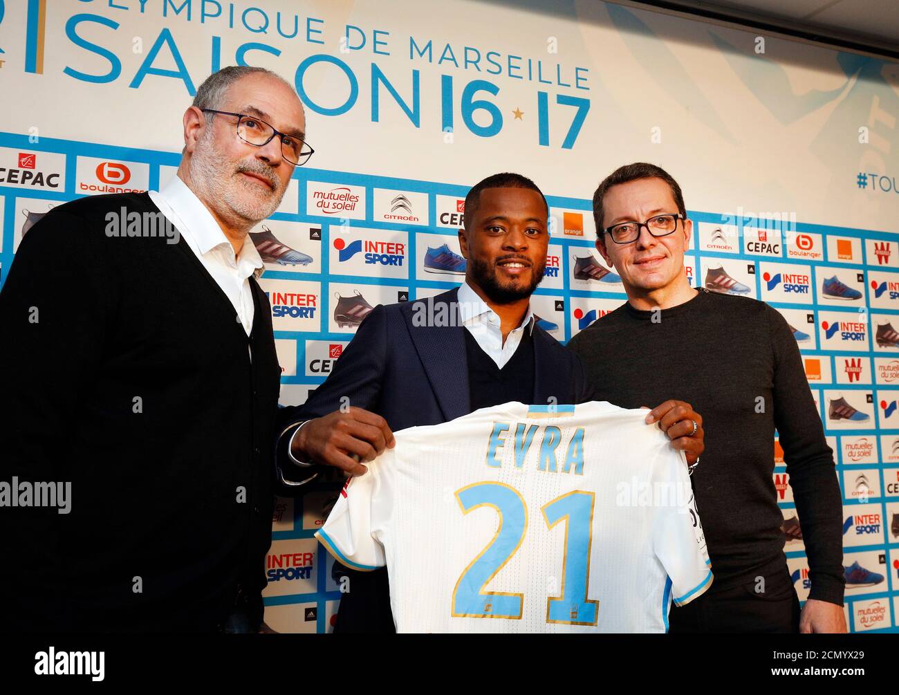 Olympique Marseille's latest recruit Patrice Evra (C) displays his new jersey with Olympique Marseille President Jacques-Henri Eyraud (R) and Sport Director Andoni Zubizarreta after a news conference in Marseille, France, January 26, 2017. REUTERS/Philippe Laurenson Stock Photo