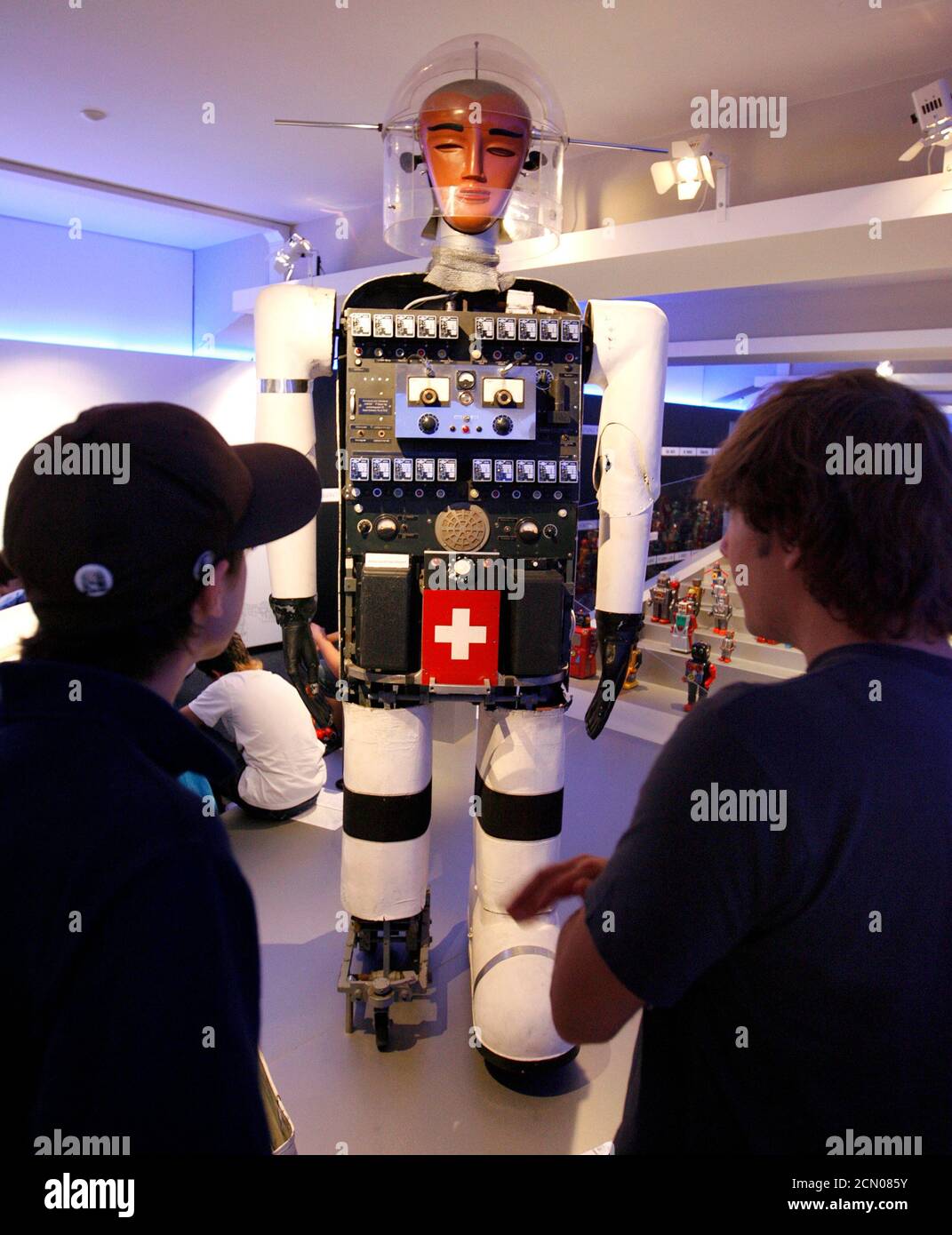 Young visitors stand in front of Swiss robot Sabor V from the 1950s at the  exhibition 'Robots - From Motion to Emotion ?' at the Museum fuer  Gestaltung (museum of design) in