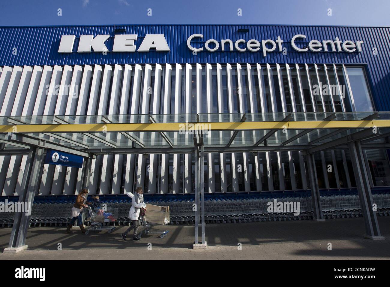 Shoppers walk outside the IKEA Concept Center, a furniture store and  headquarters of the IKEA brand owner Inter IKEA, in Delft, the Netherlands  March 16, 2016. REUTERS/Yves Herman Stock Photo - Alamy
