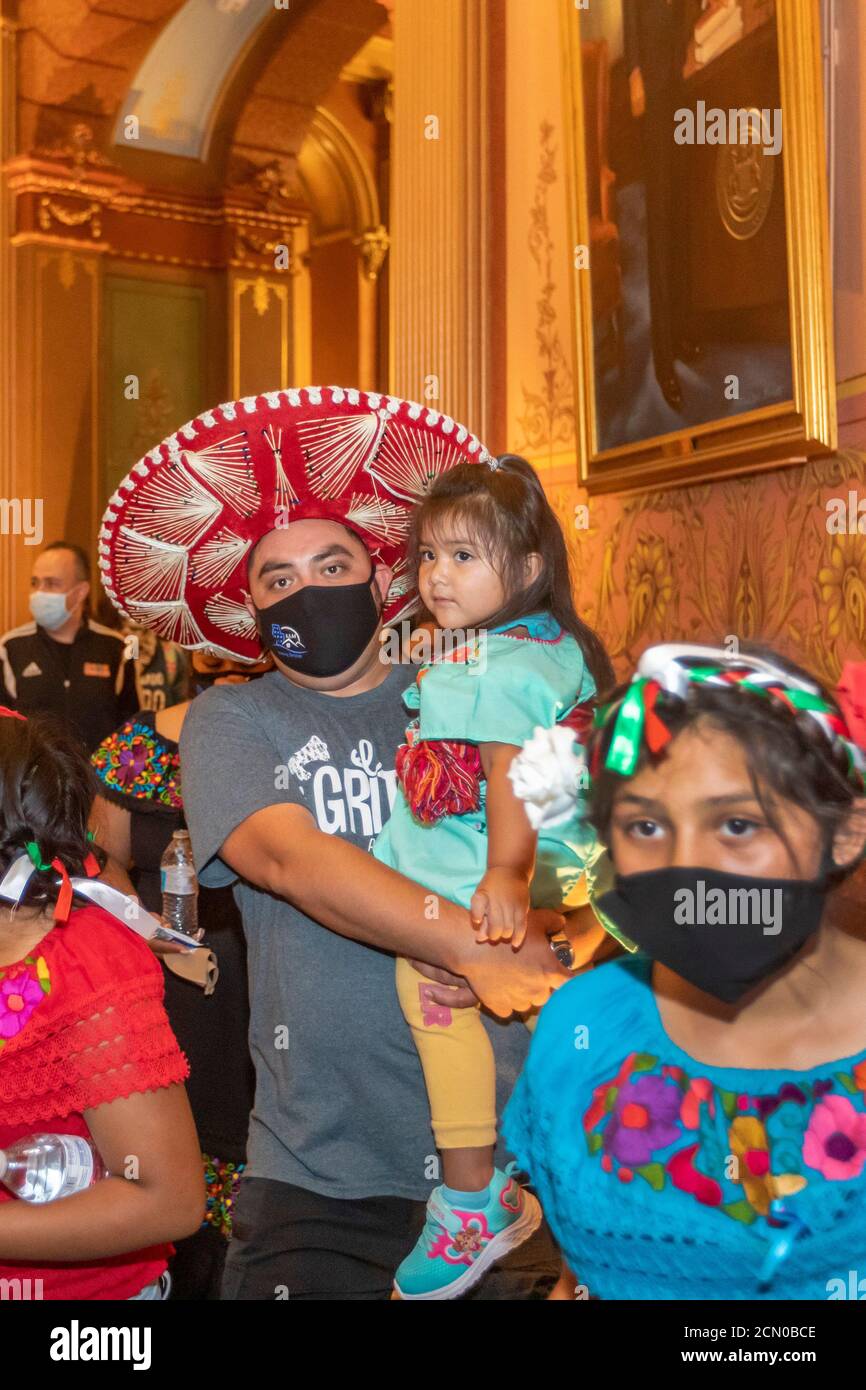 Lansing, Michigan - Activists rally in the Michigan State Capitol building, demanding that the legislature allow undocumented immigrants to get driver Stock Photo