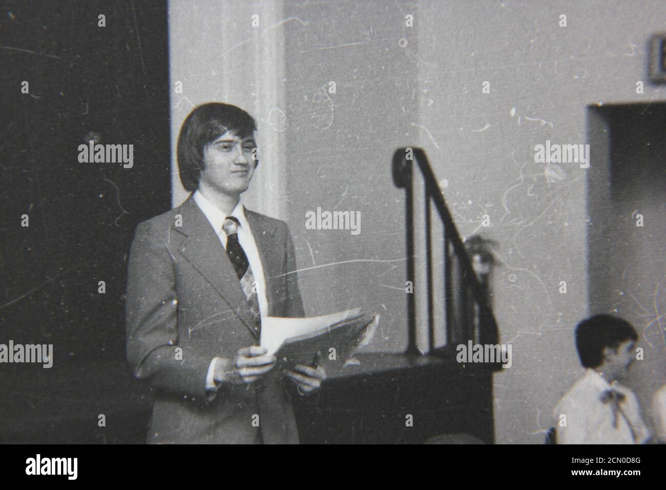 Fine 1970s vintage black and white photography of a young man giving a ...