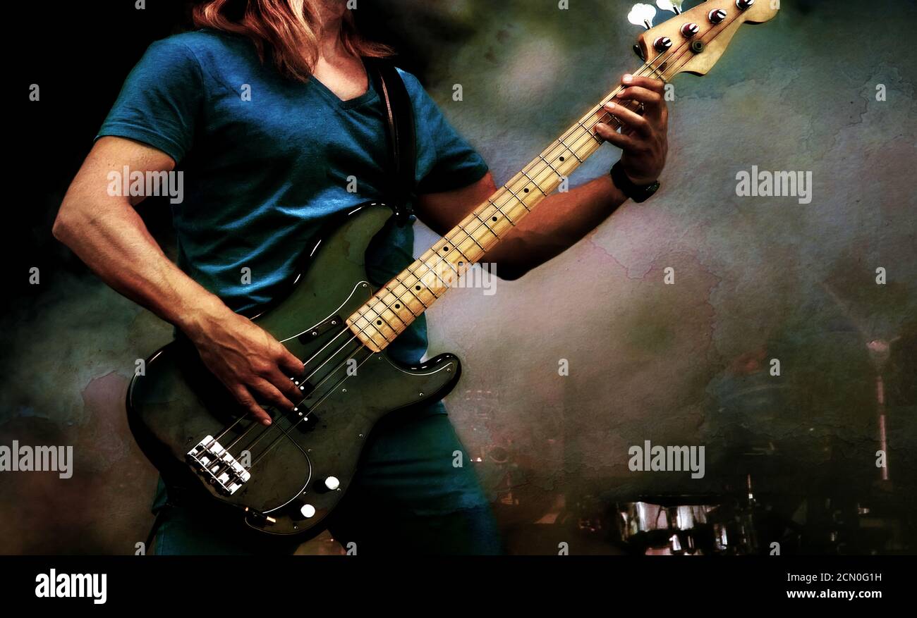 Guitarist on stage with light effects and grunge style. Close up with guitar. Young musician playing guitar, live musical background. Band playing on Stock Photo