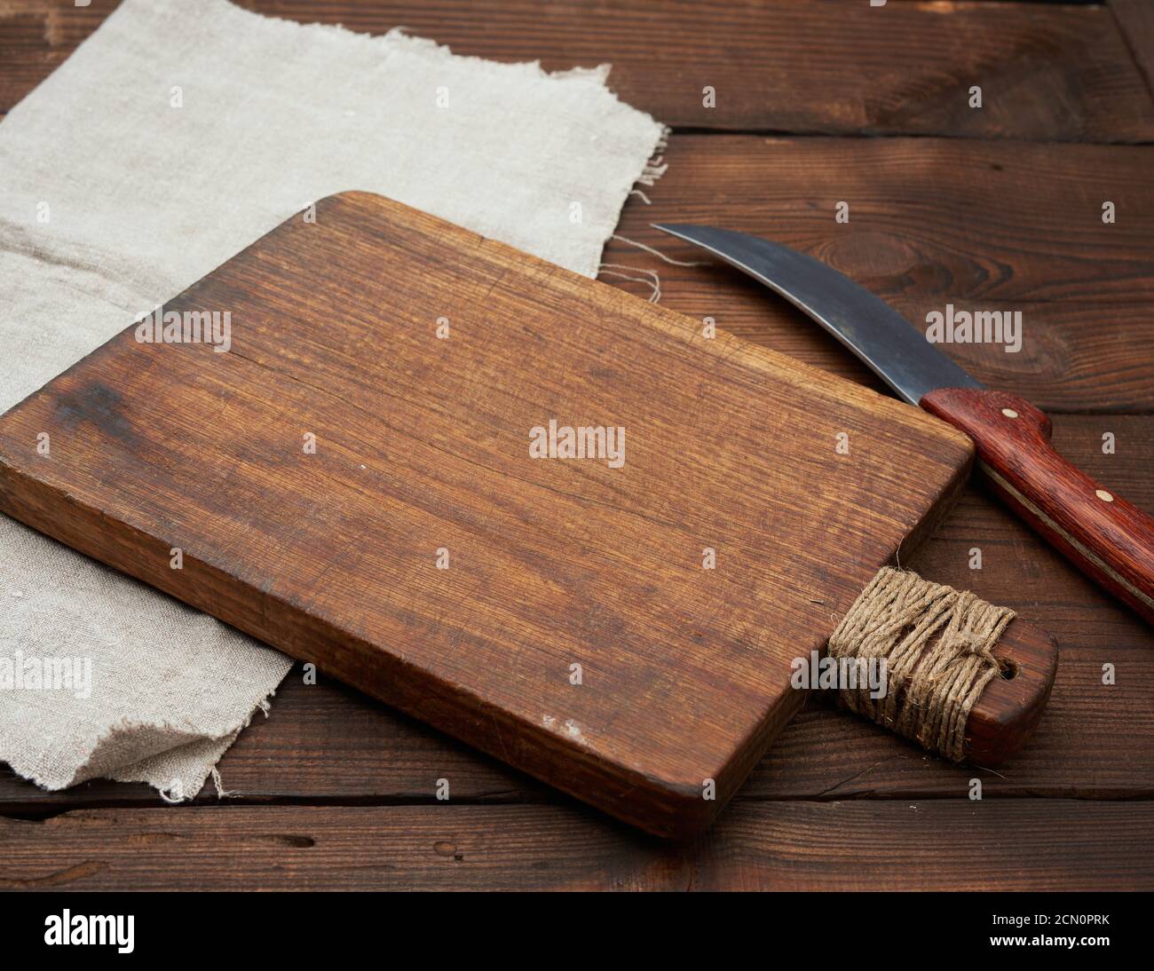 very old empty wooden rectangular cutting board and knife, top view ...