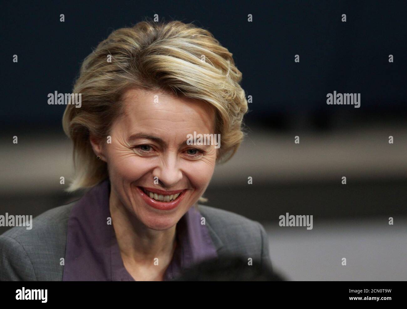 German Labour Minister Ursula von der Leyen smiles after the lower house of parliament, the Bundestag, voted on a reform of the minimum jobseekers allowance Hartz IV, in Berlin, February 25, 2011. REUTERS/Thomas Peter  (GERMANY - Tags: POLITICS) Stock Photo