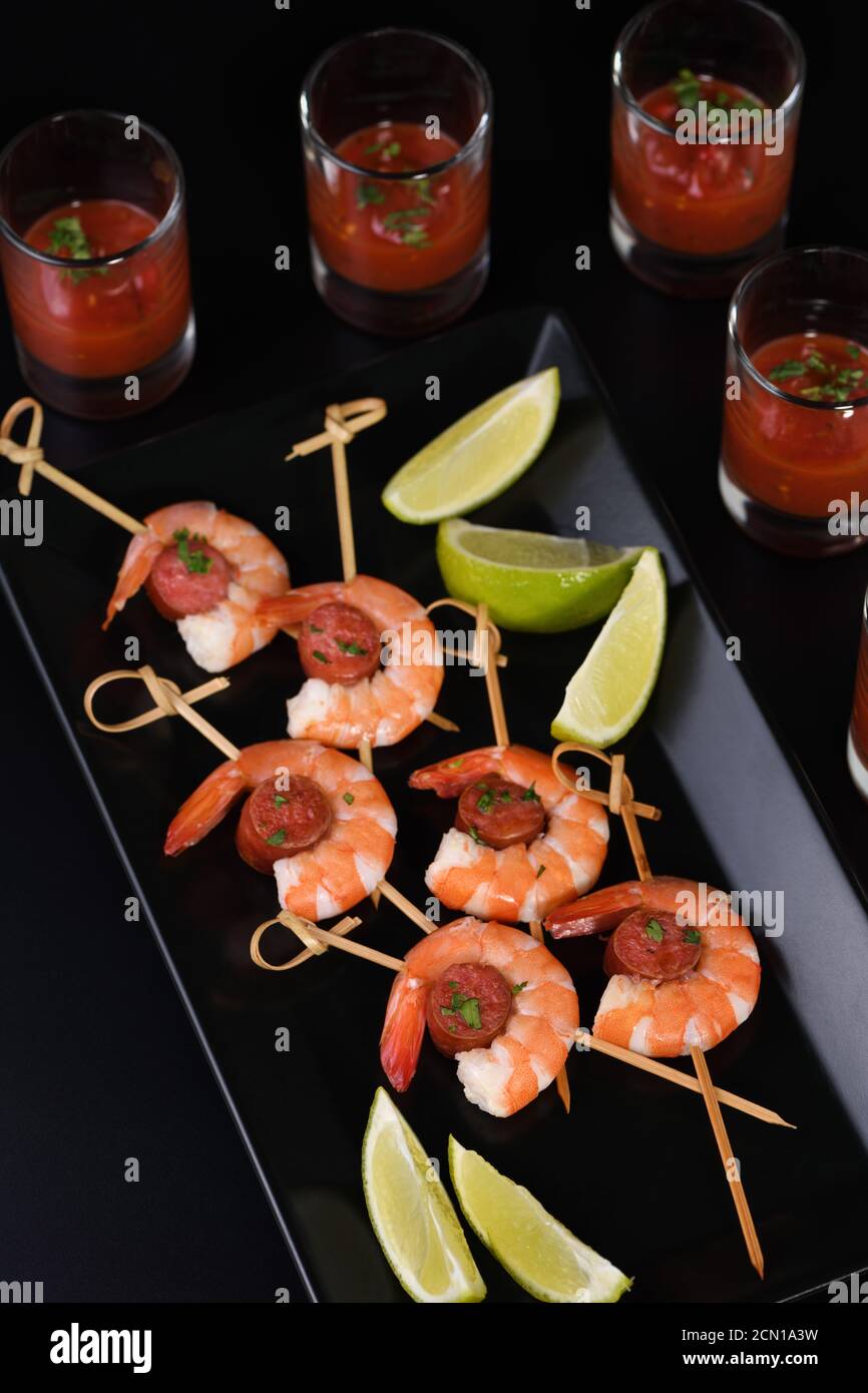 Appetizer of shish kebab with shrimps and chorizo sausages with