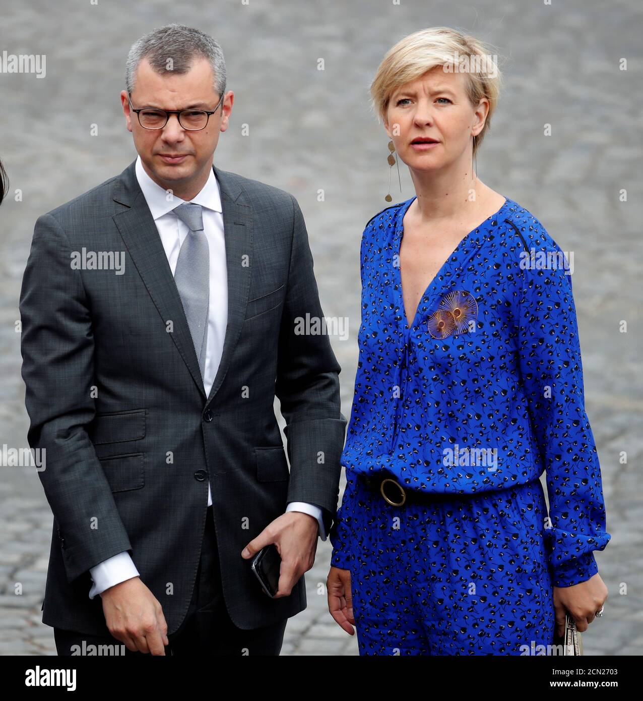 Elysee general secretary Alexis Kohler and his wife Sylvie Schirm arrive to  attend the traditional Bastille