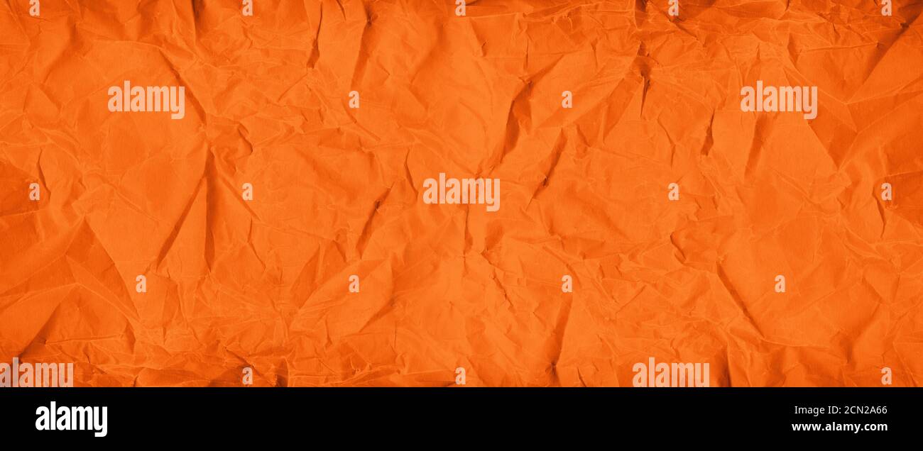 Orange crumpled paper texture. Banner background Stock Photo