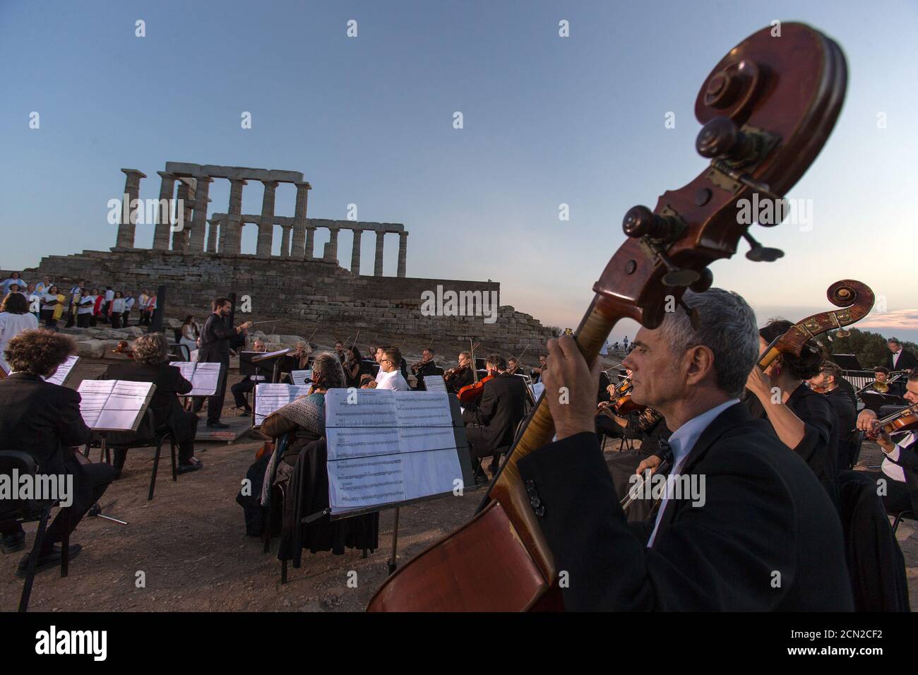 (200917) -- ATHENS, Sept. 17, 2020 (Xinhua) -- Musicians perform a musical in front of the ruins of the Temple of Poseidon at cape Sounion, some 70 km southeast of Athens, Greece, on Sept. 17, 2020. On the occasion of the 70th anniversary of the establishment of the Greek National Tourism Organization (GNTO) and the 71st anniversary of the founding of the People's Republic of China and the Mid-Autumn festival, a musical entitled 'As long as there shall be Achaeans -- Variations on a Sunbeam' was staged on Thursday in front of the ruins of the emblematic 2,500-year-old Temple of Poseidon, the g Stock Photo