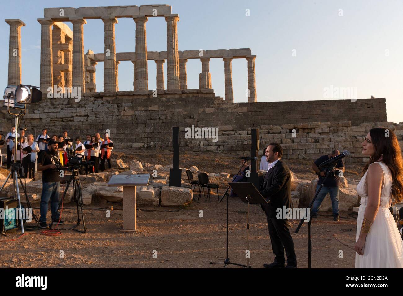(200917) -- ATHENS, Sept. 17, 2020 (Xinhua) -- Singers perform a musical in front of the ruins of the Temple of Poseidon at cape Sounion, some 70 km southeast of Athens, Greece, on Sept. 17, 2020. On the occasion of the 70th anniversary of the establishment of the Greek National Tourism Organization (GNTO) and the 71st anniversary of the founding of the People's Republic of China and the Mid-Autumn festival, a musical entitled 'As long as there shall be Achaeans -- Variations on a Sunbeam' was staged on Thursday in front of the ruins of the emblematic 2,500-year-old Temple of Poseidon, the god Stock Photo