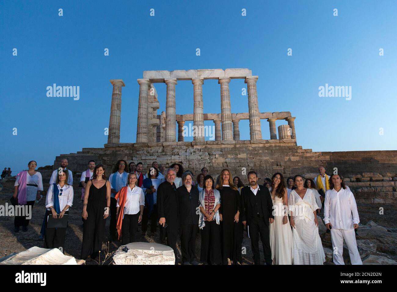 (200917) -- ATHENS, Sept. 17, 2020 (Xinhua) -- Chinese Ambassador to Greece Zhang Qiyue (6th R, Front) poses for a group photo with guests and musical performers in front of the ruins of the Temple of Poseidon at cape Sounion, some 70 km southeast of Athens, Greece, on Sept. 17, 2020. On the occasion of the 70th anniversary of the establishment of the Greek National Tourism Organization (GNTO) and the 71st anniversary of the founding of the People's Republic of China and the Mid-Autumn festival, a musical entitled 'As long as there shall be Achaeans -- Variations on a Sunbeam' was staged on Th Stock Photo