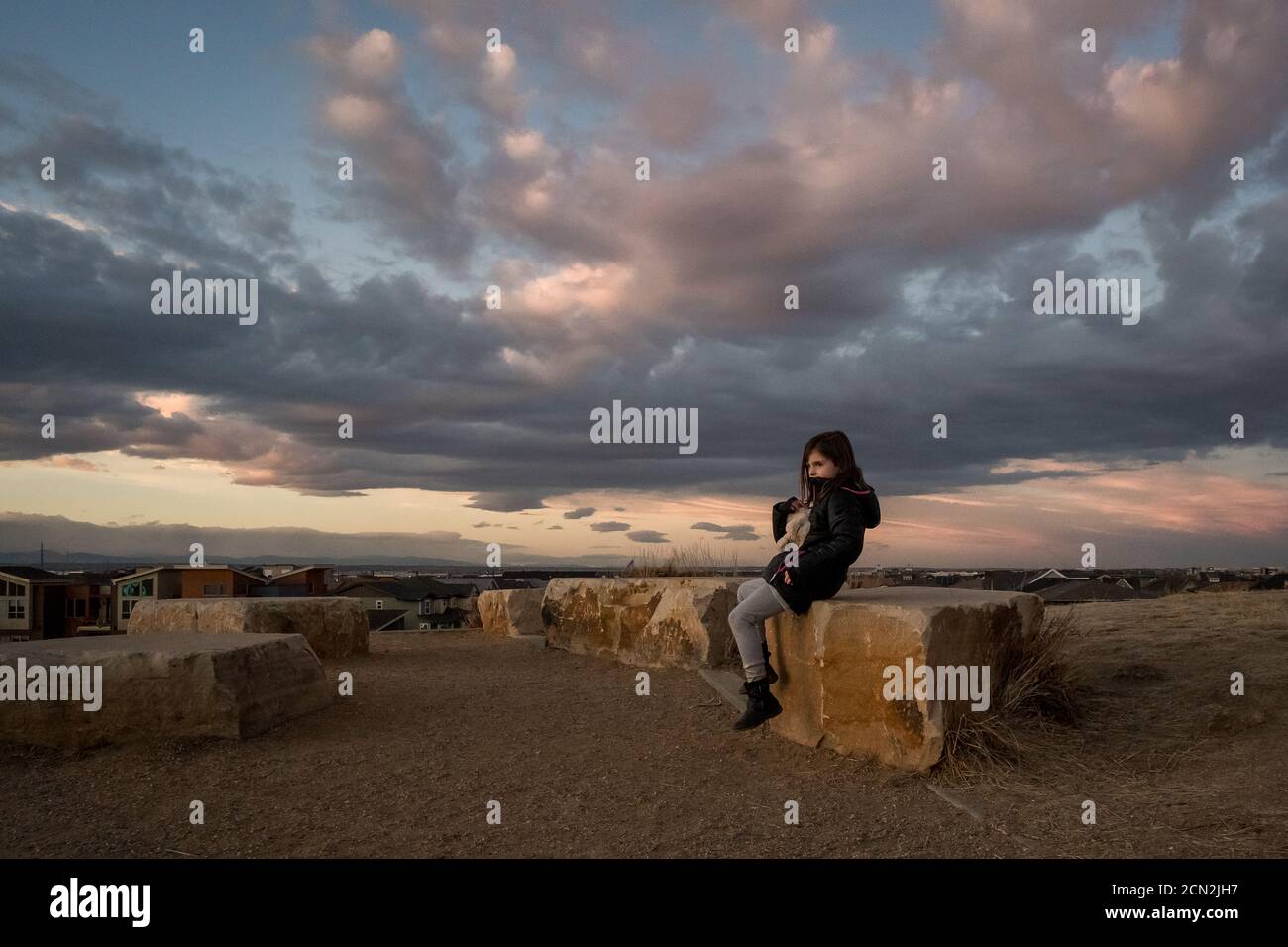 Girl sitting on top hill hi-res stock photography and images - Alamy