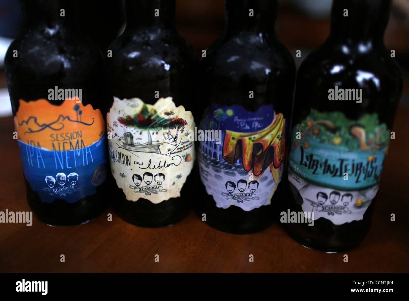 A set of bottles of 3 Cariocas beer is displayed during a tasting event