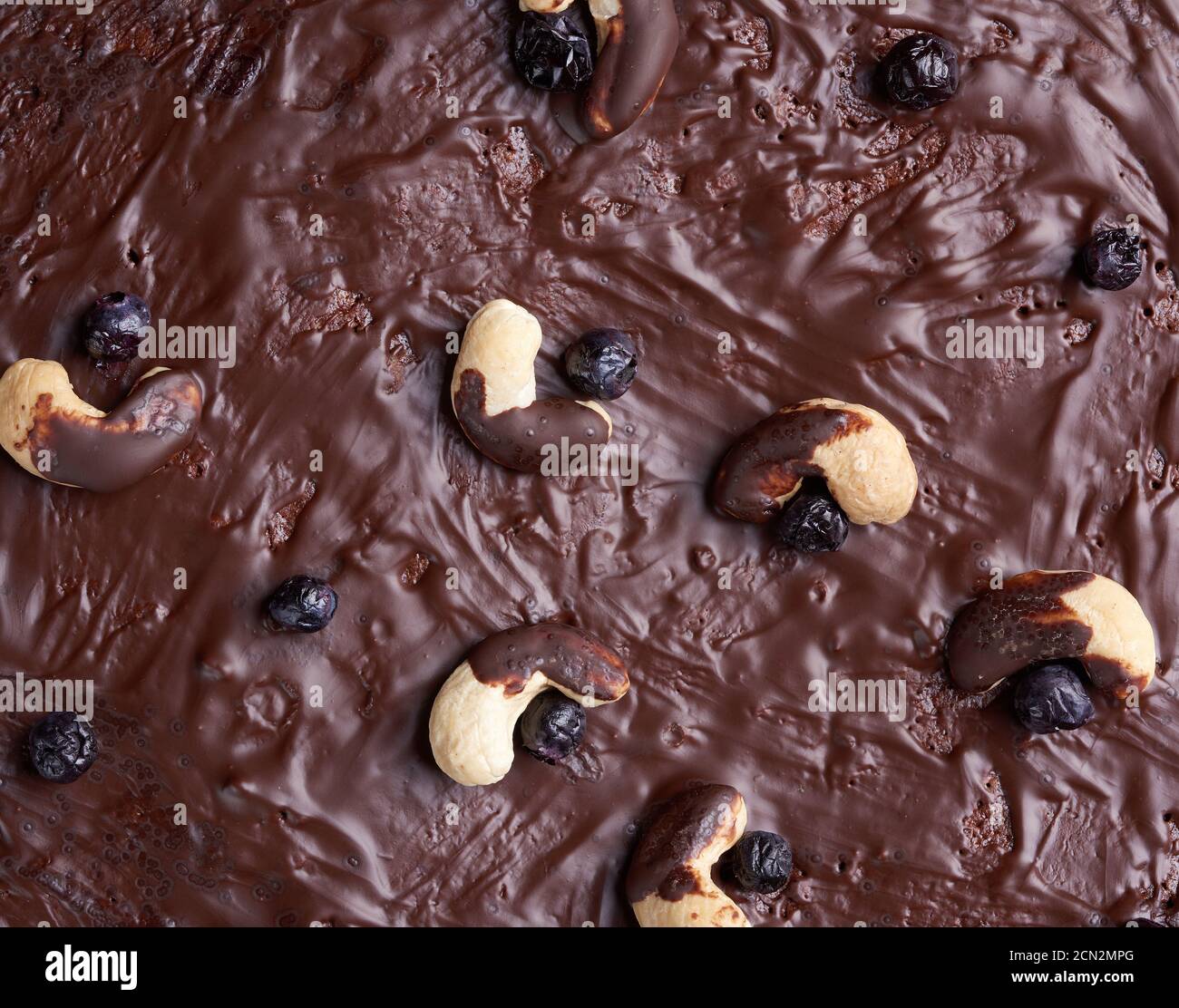 texture of baked brownie chocolate cake with chocolate poured. Cooked homemade food. Chocolate pastr Stock Photo