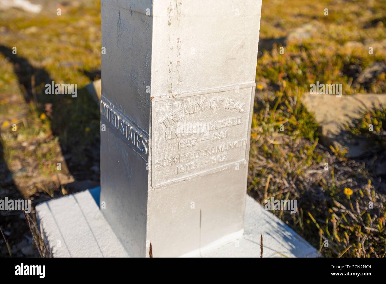 Base of international border marker on mountain ridge Stock Photo Alamy