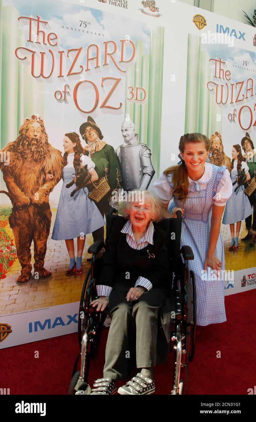 Ruth Duccini, 95, who portrayed the Munchkin Town Lady in the classic film 'The Wizard of Oz' poses with actress Danielle Wade (back), who portrays character Dorothy in the North American tour of Andrew Lloyd Webber's new stage adaptation of The Wizard of Oz, at the world premiere screening of 'The Wizard of Oz' in IMAX 3D at the grand opening of the TCL Chinese Theatre IMAX in Hollywood, California September 15, 2013. Duccini is one of two surviving Munchkins from the film which is celebrating its 75th anniversary and premiered in 1939 at the Chinese Theatre. REUTERS/Fred Prouser (UNITED STAT Stock Photo