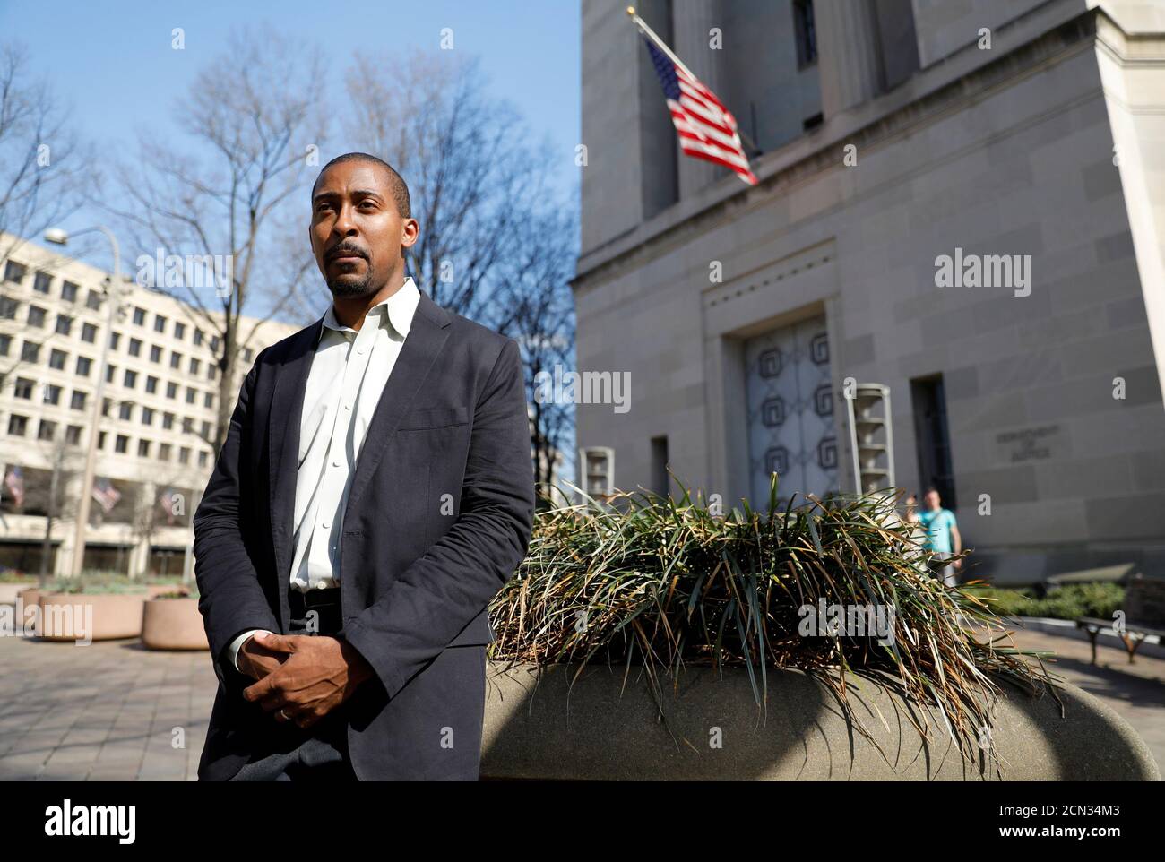 Johnathan Smith, formerly a staff attorney in the Civil Rights Division of the Obama Administration Justice Department, who is now the legal director of Muslim Advocates, stands in front of the U.S. Justice Department headquarters building where he used to work in Washington, U.S. March 9, 2017. Picture taken March 9, 2017. To match OBAMA-LAWYERS/ REUTERS/Jim Bourg Stock Photo