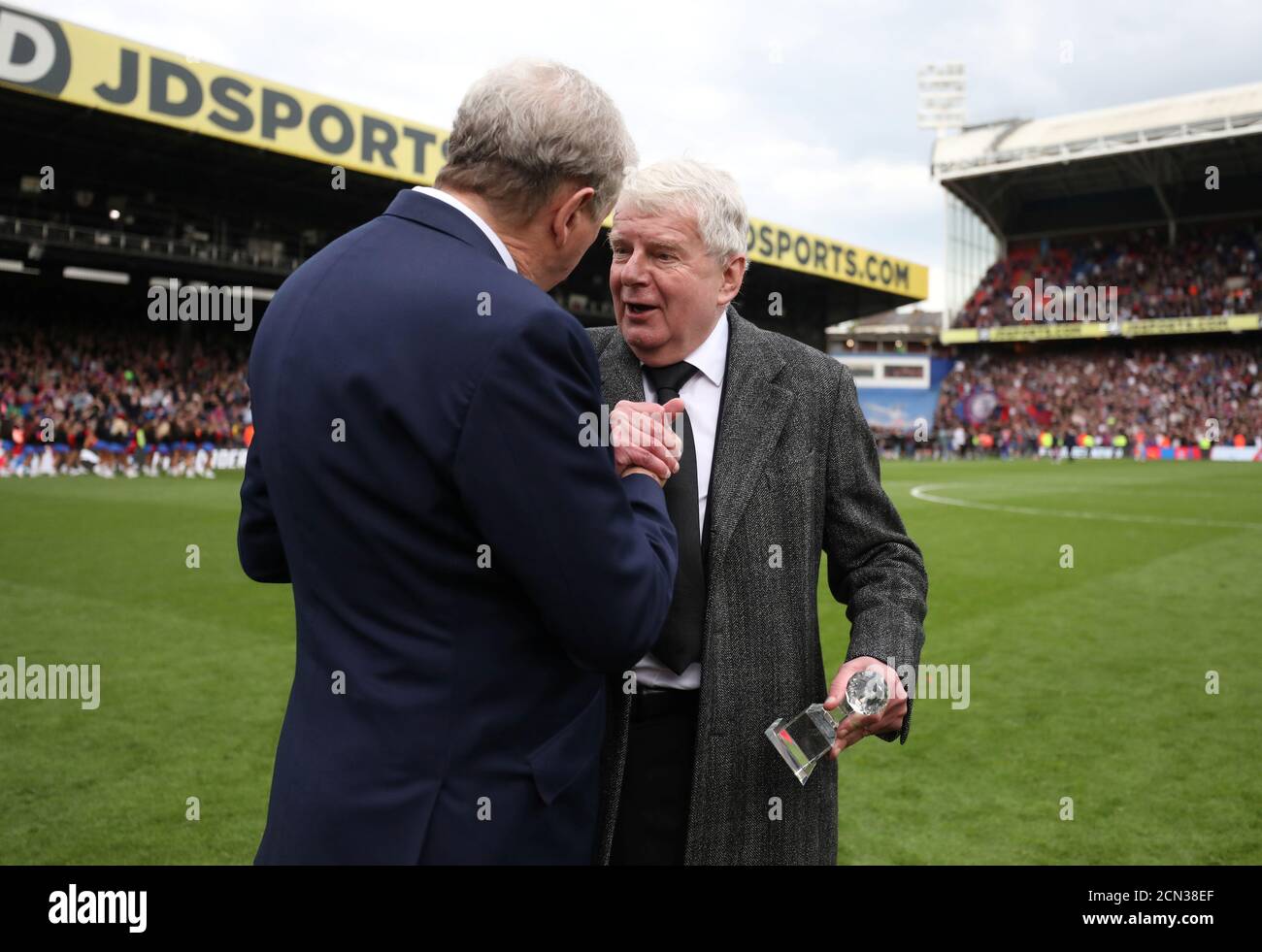 Soccer Football - Premier League - Crystal Palace vs West Bromwich Albion - Selhurst Park, London, Britain - May 13, 2018 Crystal Palace manager Roy Hodgson presents an award to commentator John Motson after the match REUTERS/Hannah McKay EDITORIAL USE ONLY. No use with unauthorized audio, video, data, fixture lists, club/league logos or "live" services. Online in-match use limited to 75 images, no video emulation. No use in betting, games or single club/league/player publications. Please contact your account representative for further details. Stock Photo