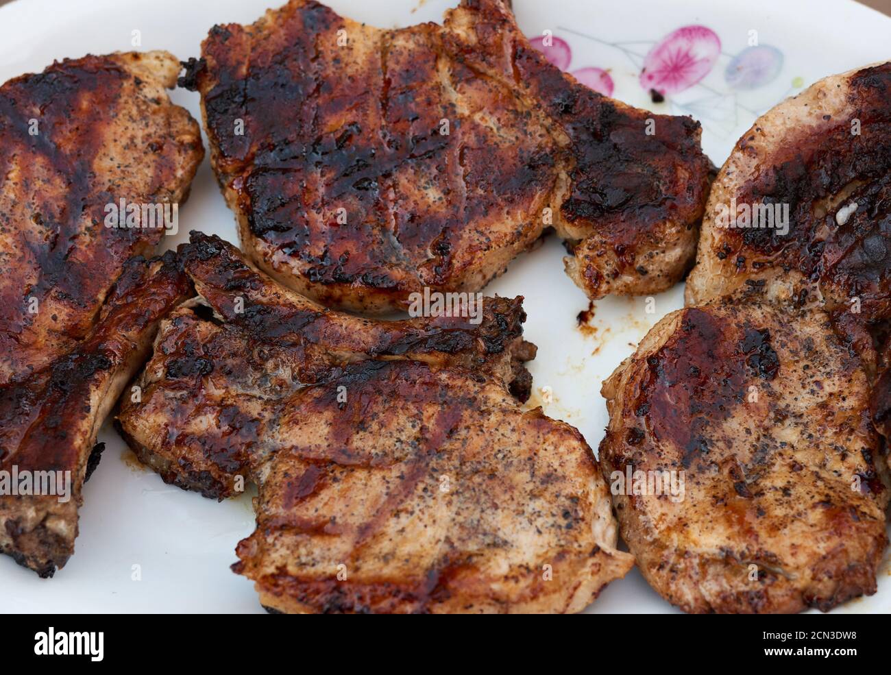 grilled pork tenderloin on the ribs, delicious food, spiced meat Stock