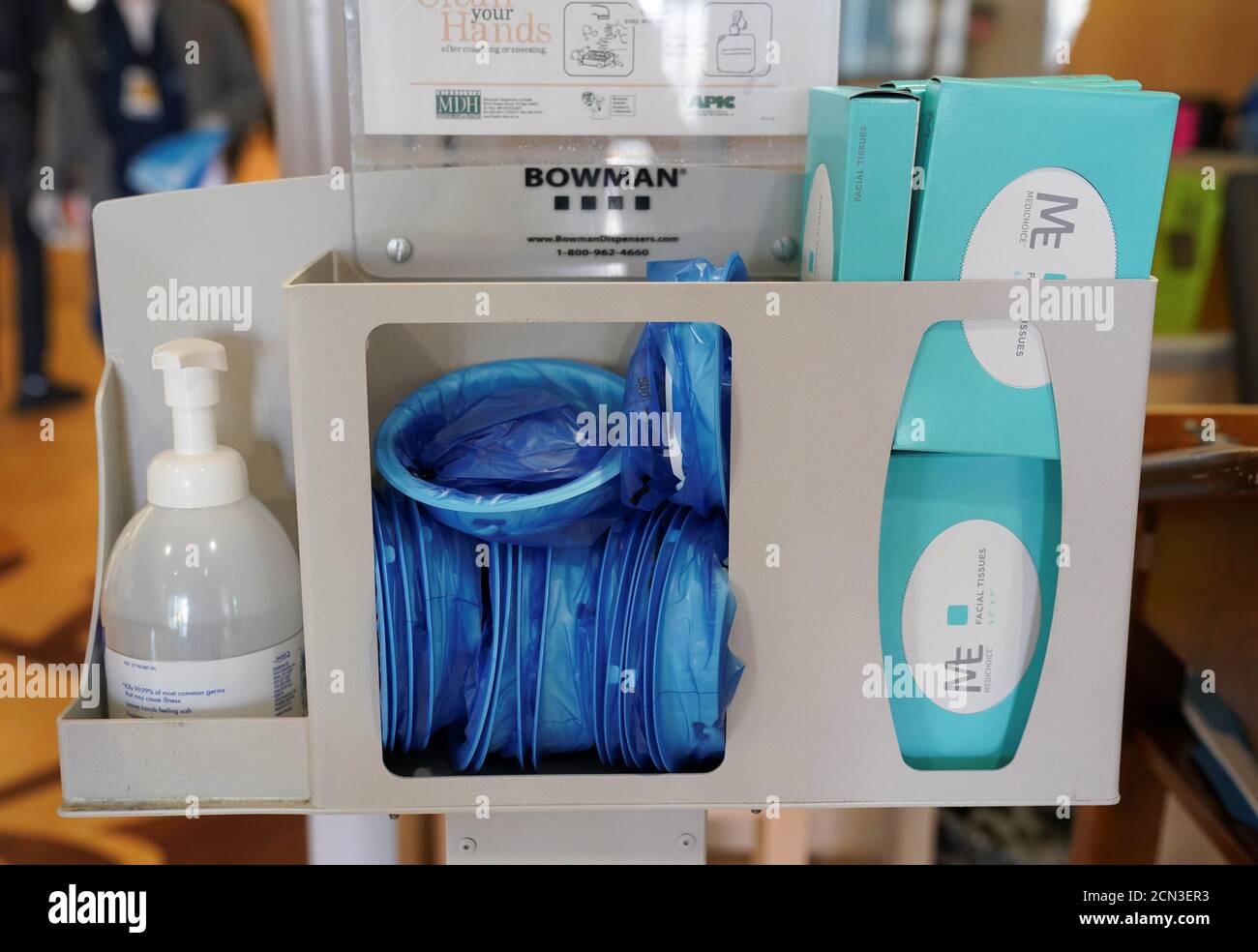 Masks and sanitizing items are on hand in a patient checkin desk for