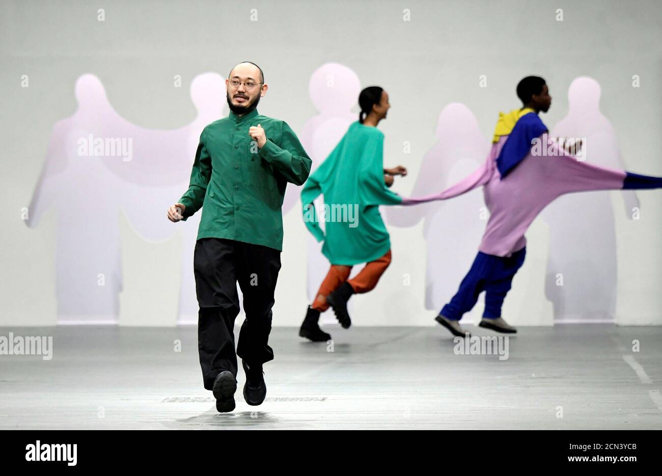 Designer Satoshi Kondo appears at the end of his Fall/Winter 2020/21 women's ready-to-wear collection show for fashion house Issey Miyake during Paris Fashion Week in Paris, France, March 1, 2020. REUTERS/Piroschka van de Wouw Stock Photo