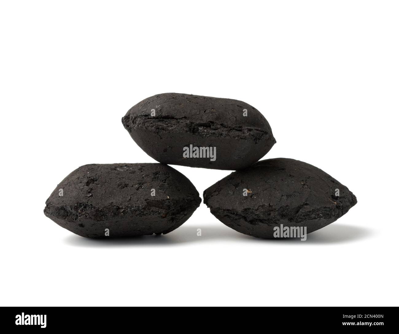 pile of black square briquettes of pressed charcoal for barbecue and bonfires Stock Photo