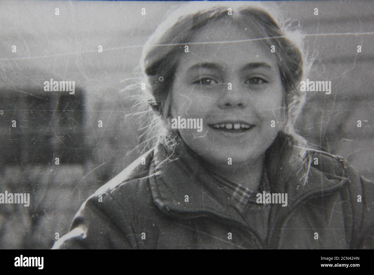 Fine 1970s vintage black and white photography of a young girl running