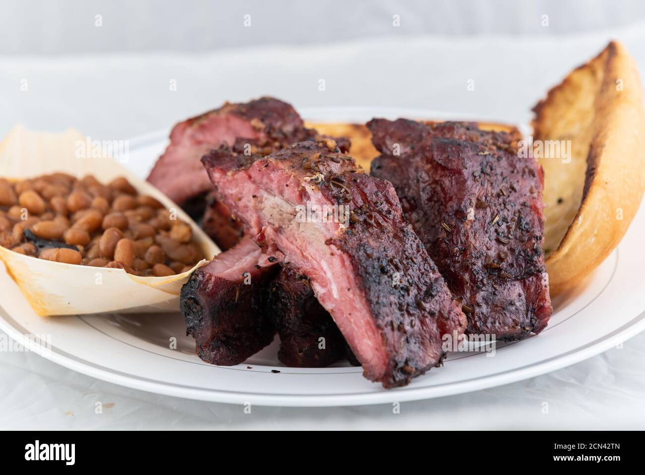 BBQ meal of half slab of ribs, baked beans, and butter toasted bread